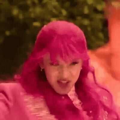 Woman With Pink Hair Making A Face GIF