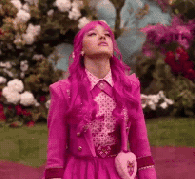 Woman With Pink Hair Sitting In Pink Flowers GIF
