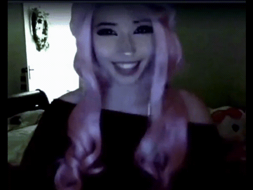 Woman With Pink Hair Smiling In Black Top GIF