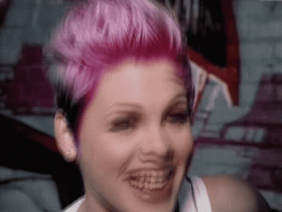 Woman With Pink Hair Smiling With Braces GIF