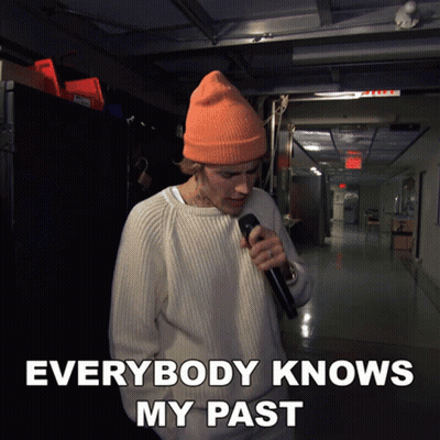 Woman With Pink Hair Standing In Front Of 666 Sign GIF