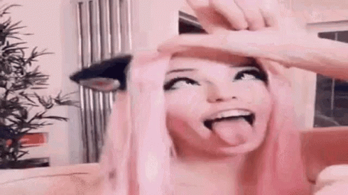 Woman With Pink Hair Sticking Tongue Out GIF