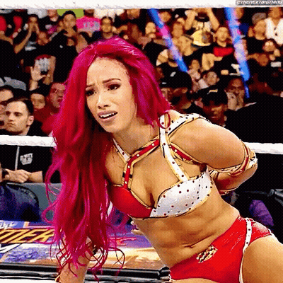 Woman With Pink Hair Tied Up in Wrestling Ring