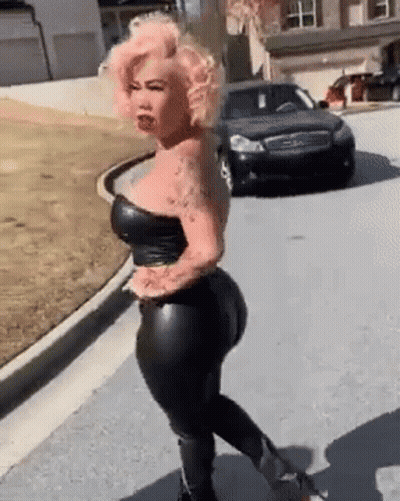 Woman With Pink Hair Walking Next To Black Car GIF