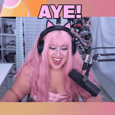 Woman With Pink Hair Wearing Headphones And Microphone Says Aye GIF