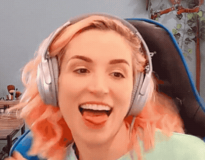 Woman With Pink Hair Wearing Headphones Sticking Tongue Out GIF