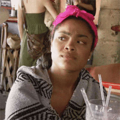 Woman With Pink Headband Looking At Camera GIF