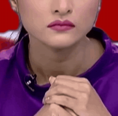 Woman With Pink Lipstick And Purple Shirt GIF