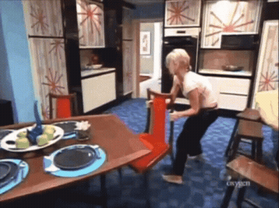 Woman With Plate Of Apples Beside Red Chair GIF