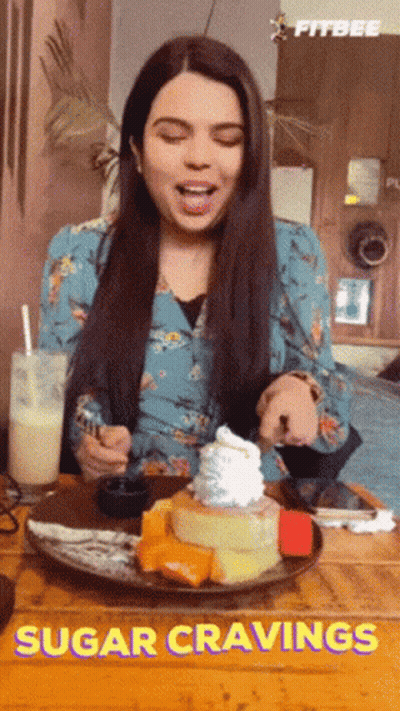Woman With Plate Of Food And Sugar Cravings GIF