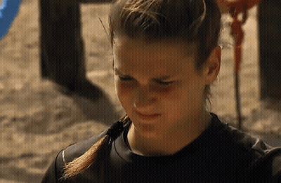 Woman With Ponytail And Black Shirt On Sand GIF