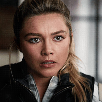 Woman With Ponytail And Black Vest GIF