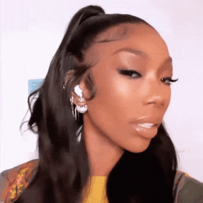 Woman With Ponytail And Earrings GIF