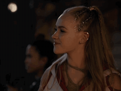 Woman With Ponytail And Glitter In Hair GIF
