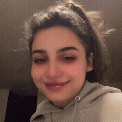Woman With Ponytail And Hoodie GIF