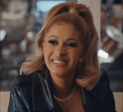 Woman With Ponytail And Necklace Smiling GIF