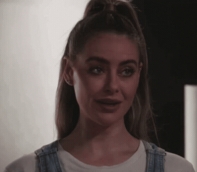 Woman With Ponytail And Overalls GIF