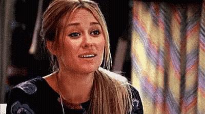 Woman With Ponytail And Striped Curtain GIF