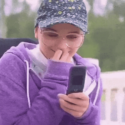 Woman With Ponytail Crying Holding Hair GIF