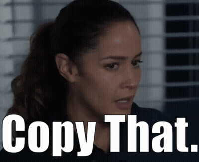 Woman With Ponytail Next To Copy That Sign GIF
