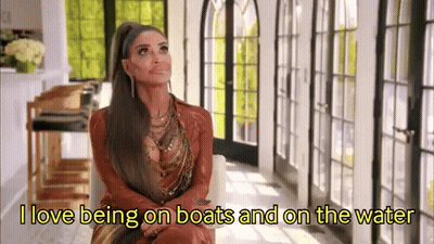 Woman With Ponytail Saying I Love Being On Boats And On The Water GIF