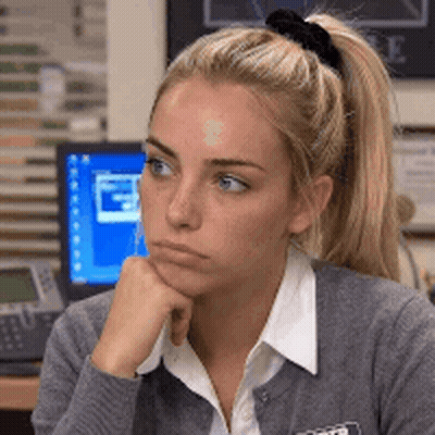Woman With Ponytail Sitting At Computer GIF