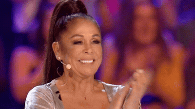 Woman With Ponytail Smiling And Clapping At Microphone GIF