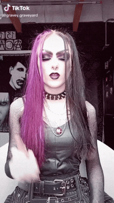 Woman With Purple And Black Hair GIF