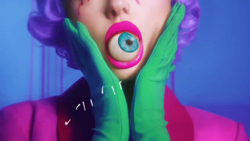 Woman With Purple Hair And Green Gloves Holding Face GIF