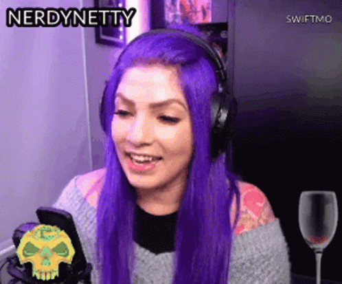 Woman With Purple Hair And Headphones Smiling At Phone GIF