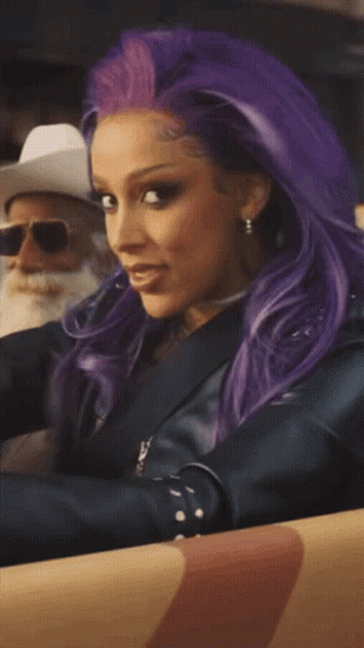 Woman With Purple Hair and Man in Cowboy Hat