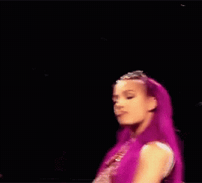 Woman With Purple Hair Holding Hair At Microphone GIF
