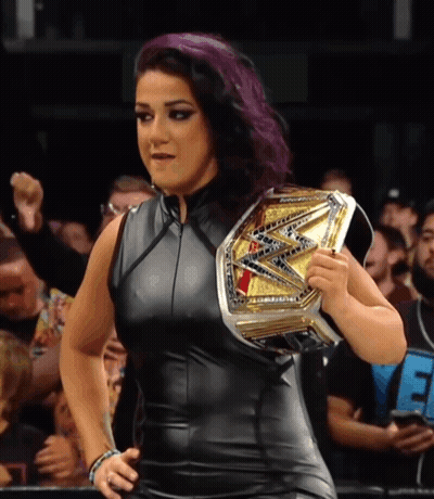 Woman With Purple Hair Holding Wrestling Championship Belt GIF