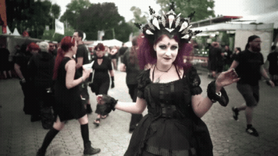 Woman With Purple Hair In Black Dress And Crown GIF
