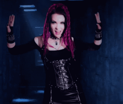 Woman With Purple Hair In Black Top And Corset GIF