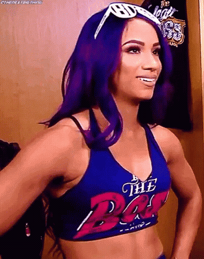 Woman With Purple Hair In Blue Top Saying The Bat GIF