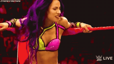 Woman With Purple Hair In Wrestling Ring Holding Rope GIF