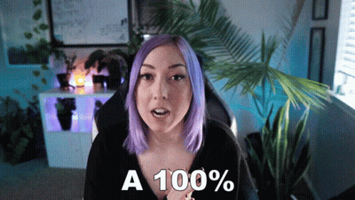 Woman With Purple Hair Saying A 100% In Front Of Palm Tree GIF