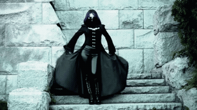 Woman With Purple Hair Standing On Steps GIF