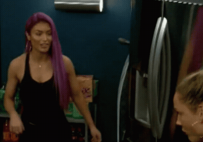 Woman With Purple Hair Talking To Another Woman In Front Of Refrigerator GIF