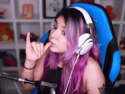 Woman With Purple Hair Wearing Headphones In Blue Chair GIF