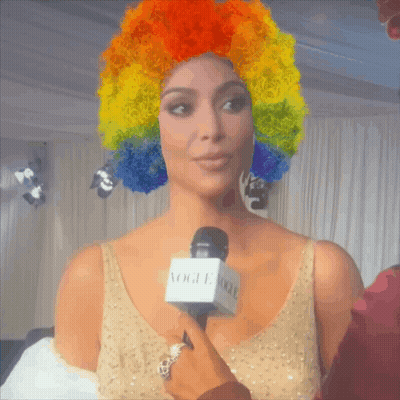 Woman with Rainbow Wig Being Interviewed