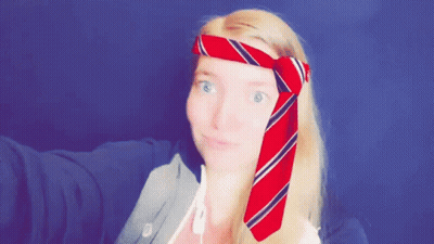 Woman With Red And Blue Striped Tie Around Head GIF