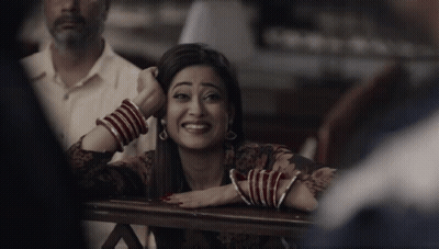 Woman With Red And White Bracelets Smiling GIF