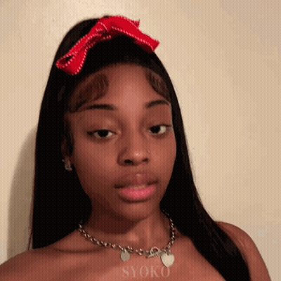 Woman With Red Bow And Heart Charm GIF