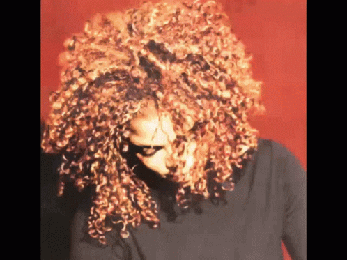 Woman With Red Curly Hair And Black Shirt GIF