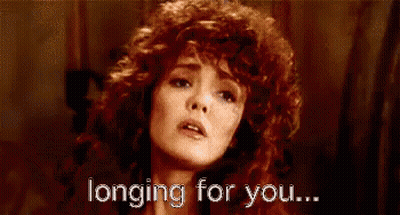 Woman With Red Curly Hair Longing For You GIF