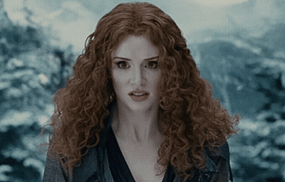 Woman With Red Curly Hair Surprised Looking At Camera GIF