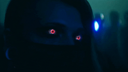 Woman With Red Eyes Wearing Face Mask GIF