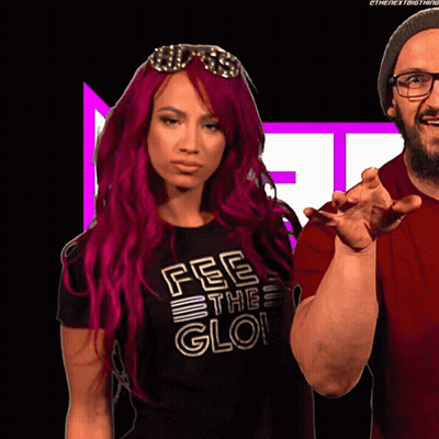 Woman With Red Hair And Black Shirt Says Fee The Glo GIF